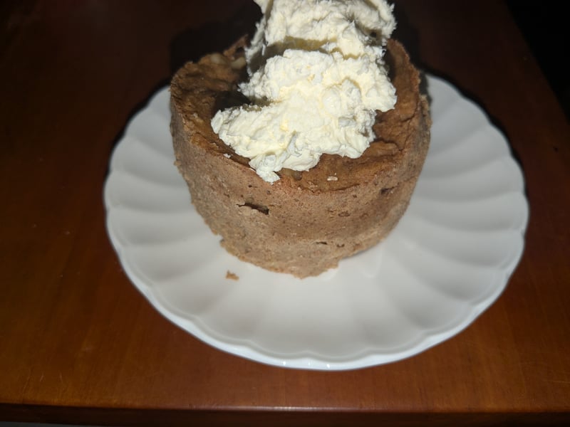 Carrot mug cake with icing on a plate
